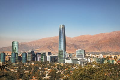 Aaerial view of Santiago skyline with Costanera skyscraper and Andes Mountains - Santiago, Chile
